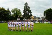 19 September 2015; The Kilmacud Crokes squad stands for the National Anthem before the game. FBD7s Senior All Ireland Football 7s at Kilmacud Crokes, Final, Kilmacud Crokes, Dublin, v Truagh Gaels, Monaghan. Glenalbyn House, Stillorgan, Co. Dublin. Picture credit: Piaras Ó Mídheach / SPORTSFILE