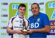 19 September 2015; Sean Fox, Kilmacud Crokes, makes a presentation of Player of the Tournament to Dara Mullin, Kilmacud Crokes. FBD7s Senior All Ireland Football 7s at Kilmacud Crokes, Final, Kilmacud Crokes, Dublin, v Truagh Gaels, Monaghan. Glenalbyn House, Stillorgan, Co. Dublin. Picture credit: Piaras Ó Mídheach / SPORTSFILE