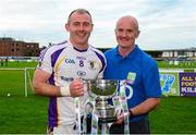 19 September 2015; Kilmacud Crokes captain Pat Burke and his father Pat snr celebrate with the cup after the game. FBD7s Senior All Ireland Football 7s at Kilmacud Crokes, Final, Kilmacud Crokes, Dublin, v Truagh Gaels, Monaghan. Glenalbyn House, Stillorgan, Co. Dublin. Picture credit: Piaras Ó Mídheach / SPORTSFILE