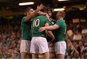 19 September 2015; Ireland's Jonathan Sexton is congratulated by team-mates Rob Kearney, left, Sean O' Brien and Keith Earls, right, after scoring a try. 2015 Rugby World Cup, Pool D, Ireland v Canada. Millennium Stadium, Cardiff, Wales. Picture credit: Stephen McCarthy / SPORTSFILE