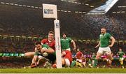 19 September 2015; Jonathan Sexton, Ireland, goes over to score his side's third try, despite the efforts of Matt Evans, left, and Gordon McRorie, Canada. 2015 Rugby World Cup, Pool D, Ireland v Canada. Millennium Stadium, Cardiff, Wales. Picture credit: Stephen McCarthy / SPORTSFILE