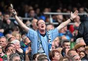 20 September 2015; A Dublin supporter celebrates a point late in the game. GAA Football All-Ireland Senior Championship Final, Dublin v Kerry, Croke Park, Dublin. Picture credit: Ramsey Cardy / SPORTSFILE