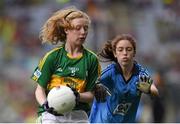 20 September 2015; Therése Kinnevey, St Annin's NS, Rosscahill, Galway, representing Kerry, and Emer Stynes, St Canice's Co Ed NS, Granges Road, Kilkenny, representing Dublin, during the Cumann na mBunscol INTO Respect Exhibition Go Games 2015 at the GAA Football All-Ireland Senior Championship Final between Dublin and Kerry at Croke Park, Dublin. Picture credit: Stephen McCarthy / SPORTSFILE