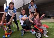 21 September 2015; Dublin players from left, Brian Fenton, Philip McMahon and Jack McCaffrey with Donnacha Mannion, age 3, from Mayo, during a visit from the GAA Football All-Ireland Champions Dublin to Our Lady's Children's Hospital, Crumlin, Dublin. Picture credit: David Maher / SPORTSFILE
