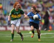 20 September 2015; Emer Stynes, St Canice's Co Ed NS, Granges Road, Kilkenny, representing Dublin, and Sinéad Clancy, Knockanean NS, Ennis, Clare, representing Kerry, during the Cumann na mBunscol INTO Respect Exhibition Go Games 2015 at the GAA Football All-Ireland Senior Championship Final between Dublin and Kerry at Croke Park, Dublin. Picture credit: Stephen McCarthy / SPORTSFILE