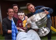 21 September 2015; Dublin's Jonny Cooper with 6 year Dean Fallon and his parents Joe and Siobhan, from Ballinasloe, Co. Galway, during a visit from the GAA Football All-Ireland Champions Dublin to Our Lady's Children's Hospital, Crumlin, Dublin. Picture credit: David Maher / SPORTSFILE
