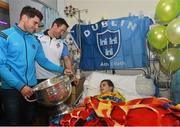 21 September 2015; Dublin's Bernard Brogan, left, and Denis Bastick meet 5 year-old Donegal supporter Declan Meehan, from Letterkenny, during a visit from the GAA Football All-Ireland Champions Dublin to Temple Street Children’s Hospital. Temple Street, Dublin. Picture credit: Ramsey Cardy / SPORTSFILE