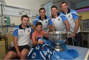 21 September 2015; Dublin players, from left, Jack McCaffrey, Nicky Devereux, Philly McMahon and Denis Bastick meet 12 year-old Dublin supporter Josh Boylan, from Portmarnock, during a visit from the GAA Football All-Ireland Champions Dublin to Temple Street Children’s Hospital. Temple Street, Dublin. Picture credit: Ramsey Cardy / SPORTSFILE