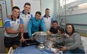 21 September 2015; Dublin players, from left, Eric Lowndes, Brian Fenton, Bernard Brogan and Philly McMahon meet Shane Moran, with father Nigel and mother Anita, from Carrick-on Shannon, Co. Leitrim, during a visit from the GAA Football All-Ireland Champions Dublin to Temple Street Children’s Hospital. Temple Street, Dublin. Picture credit: Ramsey Cardy / SPORTSFILE