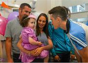 21 September 2015; Dublin's Brian Fenton meets Ava Finn, from Sligo, on her 3rd birthday during a visit from the GAA Football All-Ireland Champions Dublin to Temple Street Children’s Hospital. Temple Street, Dublin. Picture credit: Ramsey Cardy / SPORTSFILE