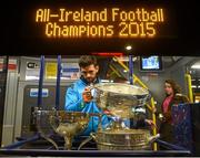 21 September 2015; Dublin's Cian O'Sullivan puts the Sam Maguire cup back on the bus after the team homecoming. O'Connell St, Dublin. Photo by Sportsfile