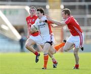 12 April 2009; John Paul Donnelly, Armagh, in action against Patrick Kelly, left, and Ger Spillane, Cork. Allianz GAA National Football League, Division 2, Round 7, Cork v Armagh, Pairc Ui Chaoimh, Cork. Picture credit: Pat Murphy / SPORTSFILE *** Local Caption ***