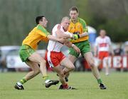 12 April 2009; Patsy Bradley, Derry, in action against Rory Kavanagh and Brendan Boyle, Donegal. Allianz GAA National Football League, Division 1, Round 7, Derry v Donegal, Maghera, Co. Derry. Picture credit: Oliver McVeigh / SPORTSFILE *** Local Caption ***