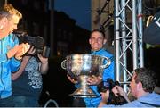 21 September 2015; Dublin's Stephen Cluxton brings the Sam Maguire cup onto the stage during the team homecoming. O'Connell St, Dublin. Photo by Sportsfile