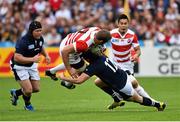 23 September 2015; Michael Broadhurst, Japan, is tackled by Matt Scott, Scotland. 2015 Rugby World Cup, Pool B, Scotland v Japan. Kingsholm Stadium, Gloucester, England. Picture credit: Ramsey Cardy / SPORTSFILE
