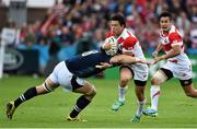 23 September 2015; Yu Tamura, Japan, is tackled by David Denton, Scotland. 2015 Rugby World Cup, Pool B, Scotland v Japan. Kingsholm Stadium, Gloucester, England. Picture credit: Ramsey Cardy / SPORTSFILE