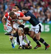 23 September 2015; Michael Broadhurst, Japan, is tackled by Ryan Wilson, left, and Alasdair Dickinson, Scotland. 2015 Rugby World Cup, Pool B, Scotland v Japan. Kingsholm Stadium, Gloucester, England. Picture credit: Ramsey Cardy / SPORTSFILE