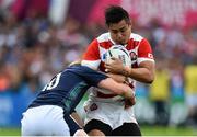 23 September 2015; Harumichi Tatekawa, Japan, is tackled by Finn Russell, Scotland. 2015 Rugby World Cup, Pool B, Scotland v Japan. Kingsholm Stadium, Gloucester, England. Picture credit: Ramsey Cardy / SPORTSFILE