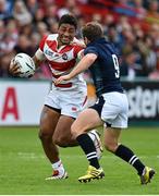 23 September 2015; Amanaki Mafi, Japan, is tackled by Greig Laidlaw, Scotland. 2015 Rugby World Cup, Pool B, Scotland v Japan. Kingsholm Stadium, Gloucester, England. Picture credit: Ramsey Cardy / SPORTSFILE