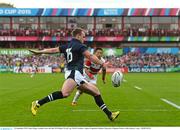 23 September 2015; Stuart Hogg, Scotland, clears the ball. 2015 Rugby World Cup, Pool B, Scotland v Japan. Kingsholm Stadium, Gloucester, England. Picture credit: Ramsey Cardy / SPORTSFILE