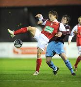 17 April 2009; Ryan Guy, St Patrick's Athletic, in action against Eoghan Osbourne, Drogheda United. League of Ireland Premier Division, St Patrick's Athletic v Drogheda United, Richmond Park, Dublin. Picture credit: Brian Lawless / SPORTSFILE