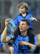 20 September 2015; Dublin's Darren Daly celebrates with his son Caolán, age 4, after the game. GAA Football All-Ireland Senior Championship Final, Dublin v Kerry, Croke Park, Dublin. Picture credit: Ramsey Cardy / SPORTSFILE