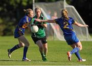 26 September 2015; Gillian McCluskey, Erin's Isle, in action against Marisa Harvey, left, and Clair Fitzgerald, right, St James'. All-Ireland Ladies Football Club Sevens Finals, Naomh Mearnog, Portmarnock, Co. Dublin. Picture credit: Seb Daly / SPORTSFILE