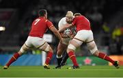 26 September 2015; Joe Marler, England, is tackled by Sam Warburton, left, and Bradley Davies, Wales. 2015 Rugby World Cup, Pool A, England v Wales, Twickenham Stadium, London, England. Picture credit: Brendan Moran / SPORTSFILE