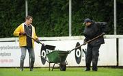 25 April 2009; Grounds men remove surface water from the pitch ahead of the game. AIB League, Division 1, Semi-Final, Cork Con v Clontarf, Temple Hill, Cork. Picture credit: Stephen McCarthy / SPORTSFILE