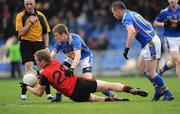 25 April 2009; Joe Ireland, Down, throws a pass under pressure from Tipperary players Brian Fox, left, and Christopher Higgins. Allianz GAA National Football League, Division 3 Final, Down v Tipperary, Pearse Park, Longford. Picture credit: Ray McManus / SPORTSFILE