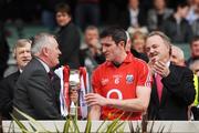 26 April 2009; New President of the GAA and Corkman Christy Cooney presents the Division 2 trophy to Cork captain Graham Canty, in the company of Paraic Duffy, left, Ard Atiurthoir of the GAA and Brendan Murphy, CEO, Allianz Ireland. Allianz GAA National Football League, Division 2 Final, Cork v Monaghan, Croke Park, Dublin. Picture credit: Brendan Moran / SPORTSFILE