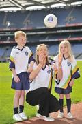 21 April 2009; Cork ladies footballer Angela Walsh, centre, with Eoin Broderick, age 8, from Corofin, Co. Galway, and Ally Cahill, age 7 from Killygarry, Co. Cavan, during the launch of the 2009 VHI GAA Cúl Camps. Now in its fourth year, the VHI GAA Cul Camps is a nationally co-ordinated programme which aims to encourage primary school children between the ages of 7 and 13, to learn and develop sporting and life-skills by participating in Gaelic games, in a fun, non-competitive environment. Last year over 83,000 children attended the VHI GAA Cúl Camps nationwide. Croke Park, Dublin. Picture credit: David Maher / SPORTSFILE