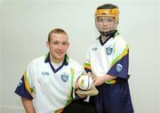 21 April 2009; Kilkenny senior hurler Richie Hogan with Sean McKee, from James Stephen, Kilkenny, at the launch of the 2009 VHI GAA Cúl Camps. Now in its fourth year, the VHI GAA Cul Camps is a nationally co-ordinated programme which aims to encourage primary school children between the ages of 7 and 13, to learn and develop sporting and life-skills by participating in Gaelic games, in a fun, non-competitive environment. Last year over 83,000 children attended the VHI GAA Cúl Camps nationwide. Croke Park, Dublin. Picture credit: Diarmuid Greene / SPORTSFILE
