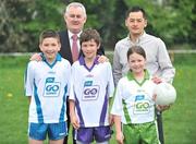 23 April 2009; GAA president Christy Cooney, with Dublin footballer Jason Sherlock with children left to right, Eric Kelly, Ben Galvin, and Caoimhe Sherlock, all from Scoil Bhríde National School, Blanchardstown, at the launch of the new Go Games Syllabus on the GAA 125 Schools' Day. Scoil Bhríde Boys National School, Blanchardstown, Dublin. Picture credit: David Maher / SPORTSFILE