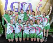 26 September 2015; Baltinglass players pose with the trophy after winning the Intermediate Championship final. All-Ireland Ladies Football Club Sevens Finals, Naomh Mearnog, Portmarnock, Co. Dublin. Picture credit: Seb Daly / SPORTSFILE