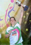 26 September 2015; Baltinglass captain Catherine Dempsey celebrates with the Intermediate Championship trophy following her team's victory. All-Ireland Ladies Football Club Sevens Finals, Naomh Mearnog, Portmarnock, Co. Dublin. Picture credit: Seb Daly / SPORTSFILE