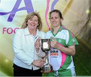 26 September 2015; Baltinglass captain Catherine Dempsey, right, is presented the Intermediate Championship trophy by Marie Hickey, President, Ladies Gaelic Football Association. All-Ireland Ladies Football Club Sevens Finals, Naomh Mearnog, Portmarnock, Co. Dublin. Picture credit: Seb Daly / SPORTSFILE