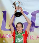 26 September 2015; Kiltubrid captain Aine Tighe celebrates with the Senior Shield trophy following her team's victory. All-Ireland Ladies Football Club Sevens Finals, Naomh Mearnog, Portmarnock, Co. Dublin. Picture credit: Seb Daly / SPORTSFILE