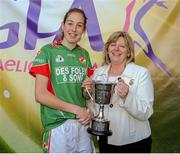 26 September 2015; Kiltubrid captain Aine Tighe is presented the Senior Shield trophy by Marie Hickey, President, Ladies Gaelic Football Association. All-Ireland Ladies Football Club Sevens Finals, Naomh Mearnog, Portmarnock, Co. Dublin. Picture credit: Seb Daly / SPORTSFILE