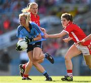 27 September 2015; Carla Rowe, Dublin, is tackled by Marie Ambrose, Cork. TG4 Ladies Football All-Ireland Senior Championship Final, Croke Park, Dublin. Picture credit: Ramsey Cardy / SPORTSFILE