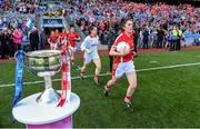 27 September 2015; Cork captain Ciara O'Sullivan leads her team out on to the pitch past the Brendan Martin Cup. TG4 Ladies Football All-Ireland Senior Championship Final, Croke Park, Dublin. Photo by Sportsfile