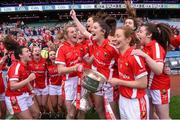 27 September 2015; Cork players Briege Corkery, left, captain Ciara O'Sullivan, and Rena Buckley, right, celebrate with the Brendan Martin Cup after the game. TG4 Ladies Football All-Ireland Senior Championship Final, Croke Park, Dublin. Photo by Sportsfile