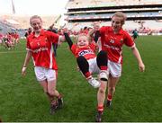 27 September 2015; Vera Foley, left, and Mairéad Corkery, Cork, celebrate with Vera's niece, three year old Layla Foley, after the game. TG4 Ladies Football All-Ireland Senior Championship Final, Croke Park, Dublin. Photo by Sportsfile