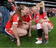 27 September 2015; Cork players Aisling Hutchings, left, Róisín Phelan, second left, and Vera Foley with 5 year-old niece Layla. TG4 Ladies Football All-Ireland Senior Championship Final, Croke Park, Dublin. Picture credit: Ramsey Cardy / SPORTSFILE