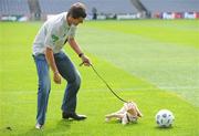 30 April 2009; Recently appointed Ipswich Town manager and Irish soccer legend Roy Keane with puppy in training Ella at the official launch of the seventh annual Irish Guide Dogs for the Blind Specsavers Shades 2009 campaign. The campaign raises funds for the training of guide and assistant dogs and centres around a week of fundraising nationwide which kicks off on Monday 4th May 2009. Croke Park, Dublin. Picture credit: Brendan Moran / SPORTSFILE