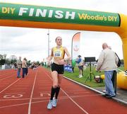 26 April 2009; Kerry Harty, from Newcastle AC, Co. Down, crosses the finish line to be the first lady home during the Woodie’s DIY/AAI 10K Road Race Championships. Claremont Stadium Club, Navan, Co. Meath. Picture credit: Matt Browne / SPORTSFILE