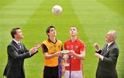 28 April 2009; Shane Guest, left, Cadbury Senior Brand manager, throws a football over to GAA PresidentChristy Cooney, far right, as Down captain Timmy Hanna, second from left, and Cork captain Colm O'Neill look on ahead of the Cadbury GAA Football U21 All-Ireland Final to be played in O'Moore Park, Portlaoise, on Monday the 4th of May. Croke Park, Dublin. Picture credit: David Maher / SPORTSFILE