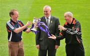 28 April 2009; GAA President Christy Cooney, centre, watches on as Down U21 manager Pete McGrath, right, throws the Cadbury GAA Football U21 All-Ireland Cup over to Cork U21 manager John Cleary ahead of the Cadbury GAA Football U21 All-Ireland Final to be played in O'Moore Park, Portlaoise, on Monday the 4th of May. Croke Park, Dublin. Picture credit: David Maher / SPORTSFILE