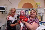 28 September 2015; 10 month old Daniel Sheehan, from Larchfiels, Cork City, with his mother Michelle and Cork ladies footballer Brid Stack during a visit by the TG4 Ladies Football All-Ireland Senior Champions to  Crumlin Children's Hospital, Crumlin, Dublin. Picture credit: Matt Browne / SPORTSFILE