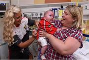 28 September 2015; 10 month old Daniel Sheehan, from Larchfiels, Cork City, with his mother Michelle and Cork ladies footballer Brid Stack during a visit by the TG4 Ladies Football All-Ireland Senior Champions to  Crumlin Children's Hospital, Crumlin, Dublin. Picture credit: Matt Browne / SPORTSFILE